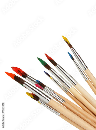 Paint brushes with gouache isolated on white