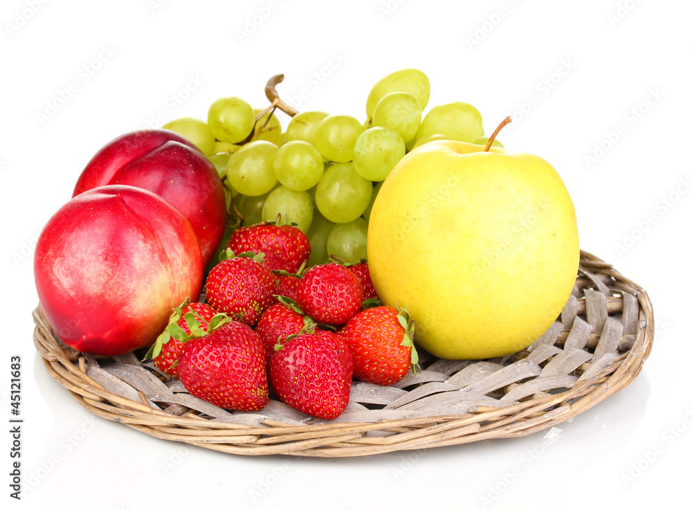 ripe sweet fruits and berries on wicker mat isolated on white ripe sweet fruits and berries on wicker mat isolated on white