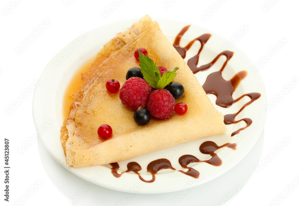 Delicious pancakes with berries,chocolate and honey