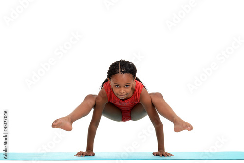 Foto Young girl doing gymnastics move