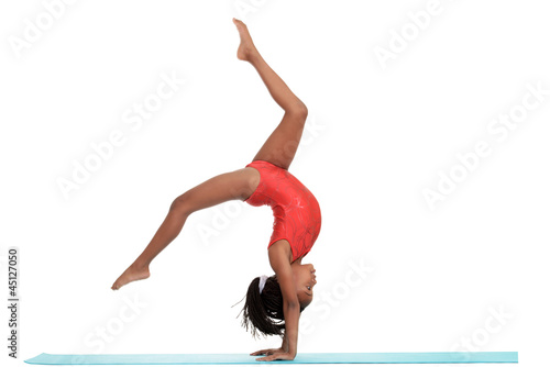 young girl doing gymnastics with motion blur photo