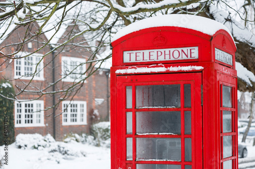 Telephone box with snow photo