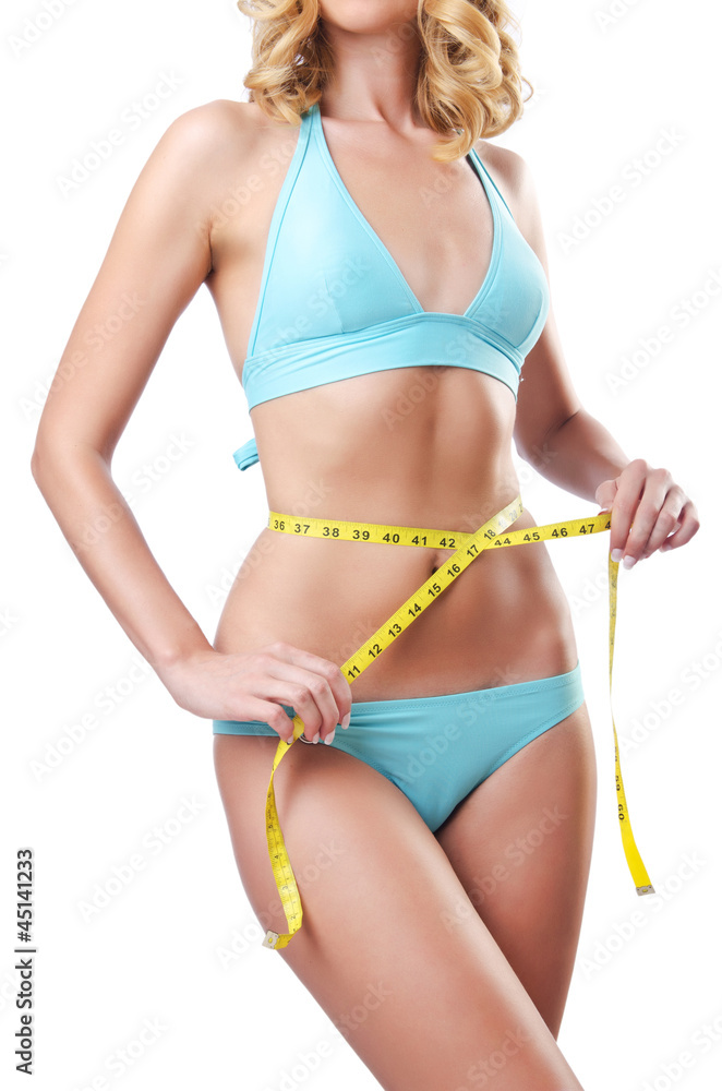 Young lady with centimetr in weight loss concept