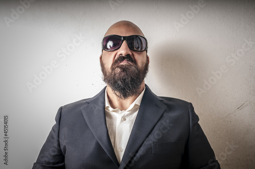 bouncer with jacket and sunglasses photo