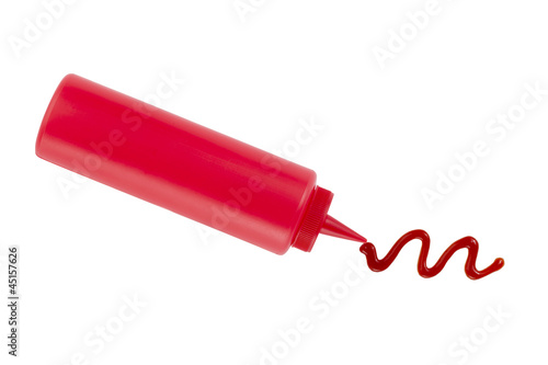 Foto catsup bottle squirt on a white background