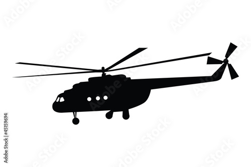 Silhouette of a helicopter in flight