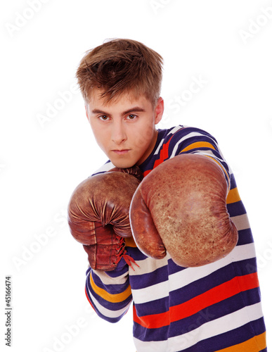 Portrait of sleazy young man posing on white background in boxin photo