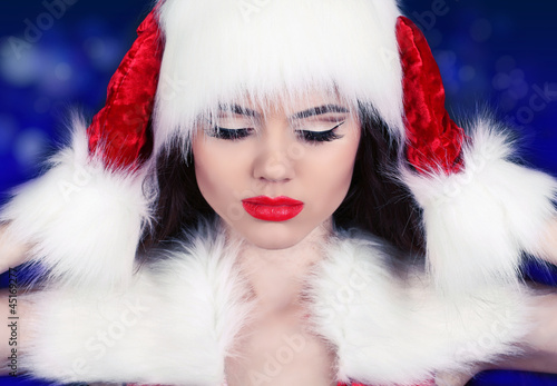 Portrait of beautiful sexy girl wearing Santa Claus clothes