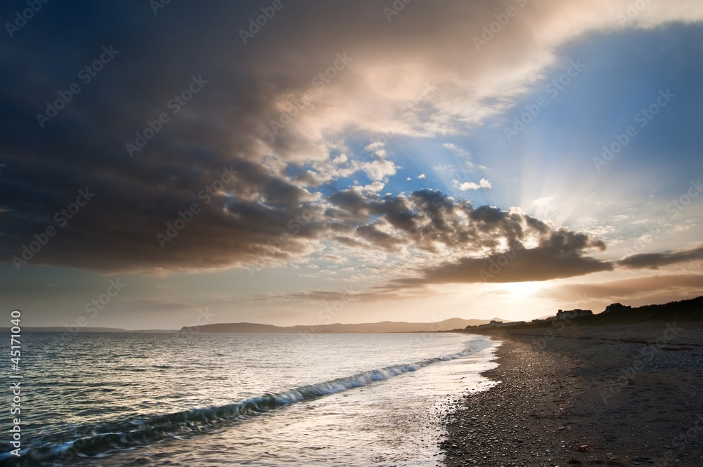 View along coast into beautiful setting sun View along coast into beautiful setting sun