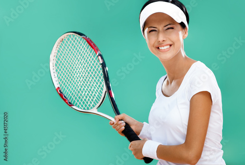 Woman in sportswear plays tennis at tournament
