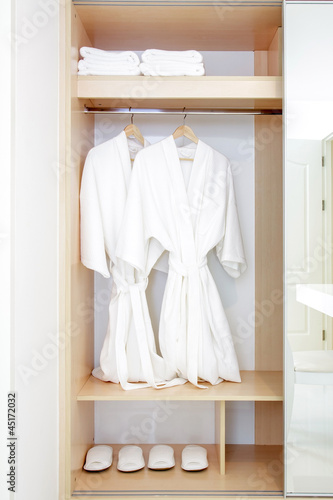 Close up of twins bathrobe in wardrobe