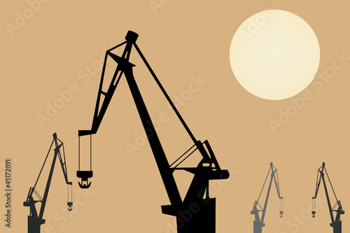 Vector drawing. Cranes at sunset