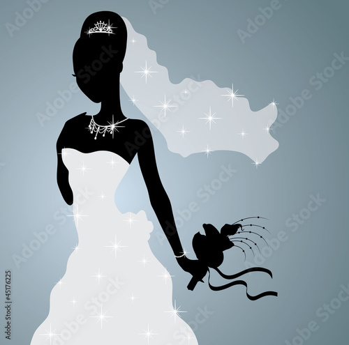 Silhouette of a beautiful bride standing and holding a bouquet.