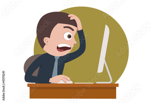Shocked businessman in front of his computer