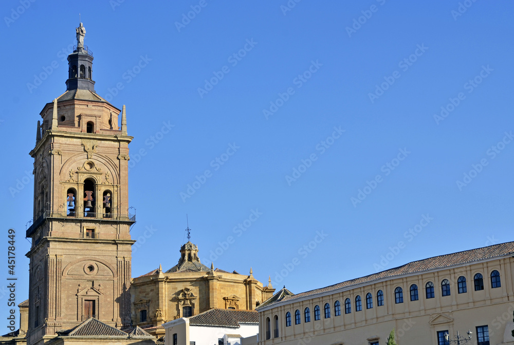 Tower of the Cathedral of Guadix and facade of the curia