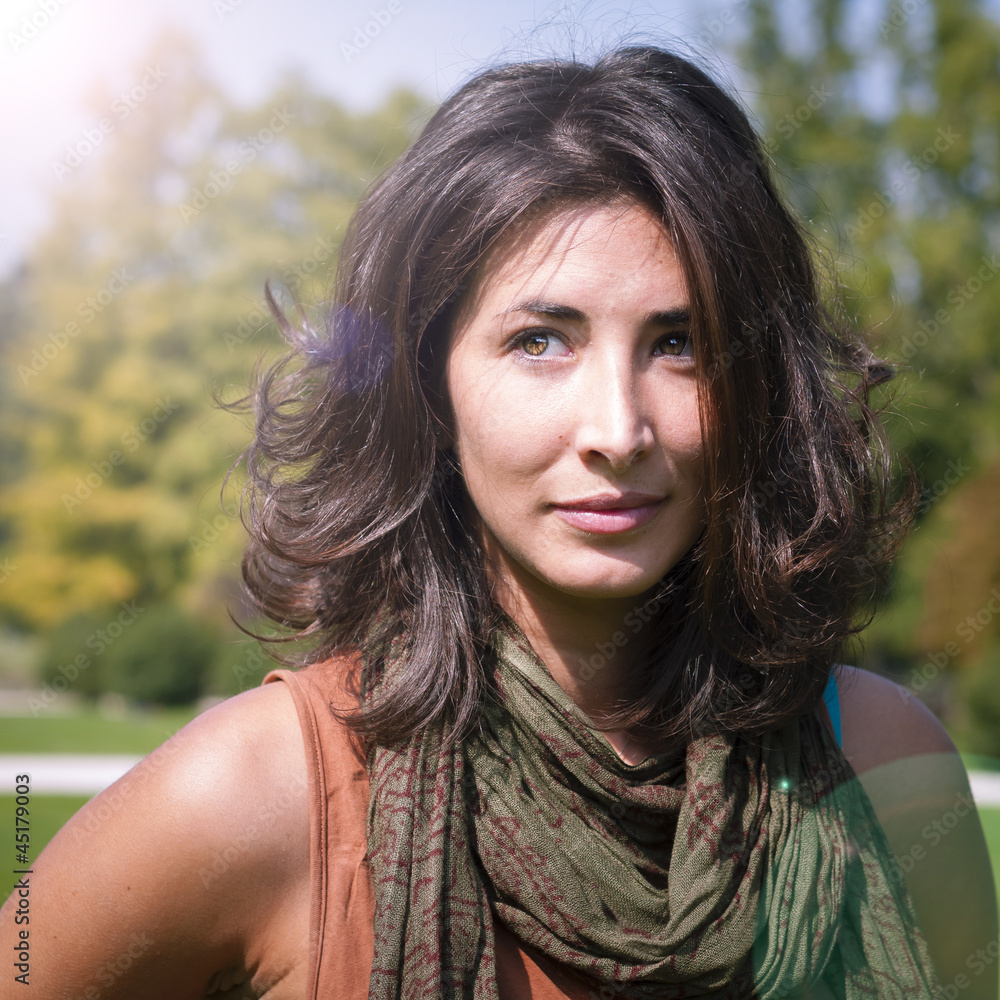 Naklejka premium beautiful girl with scarf on the lawn