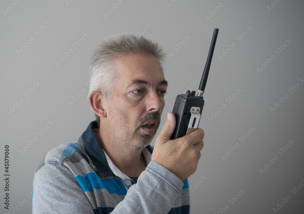 adult man talking in mobile radion adult man talking in mobile radion