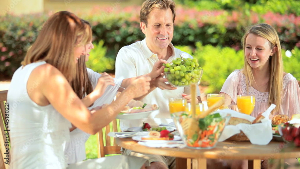 Caucasian family enjoying low calories lunch Caucasian family enjoying low calories lunch