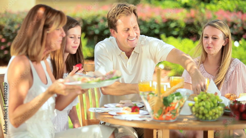Outdoor healthy picnic of young family Outdoor healthy picnic of young family