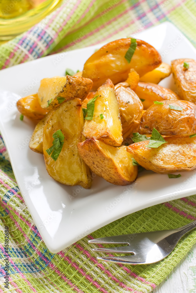 Rustic oven baked potatoes with parsley Rustic oven baked potatoes with parsley
