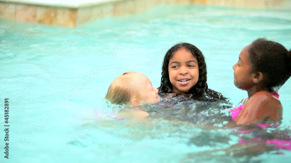 Diverse children playing activity game in swimming pool Diverse children playing activity game in swimming pool