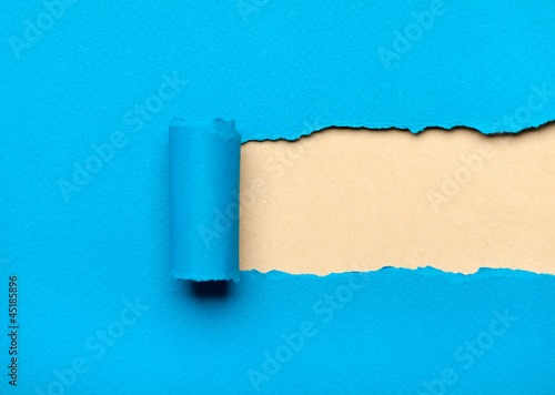 Torn light blue paper with milky copyspace for your message