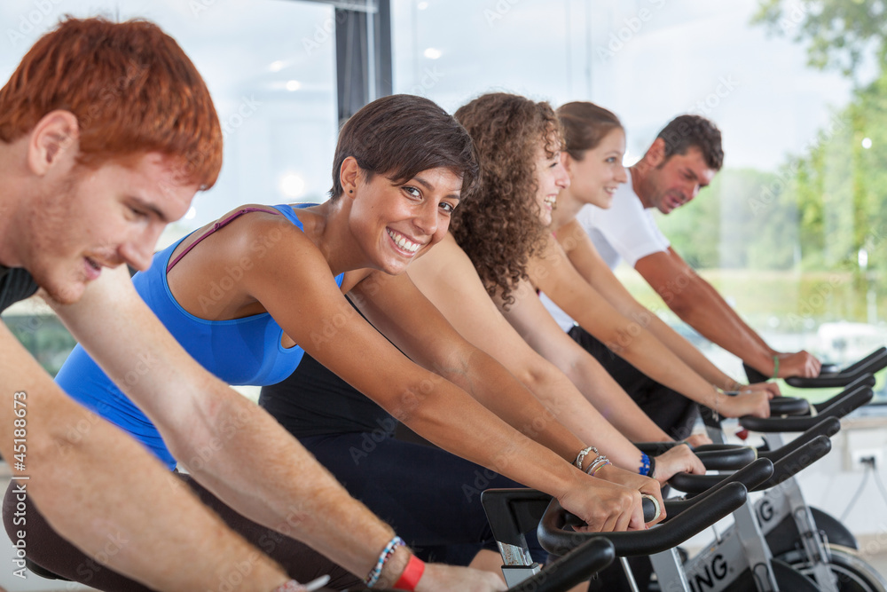 Group of People Cycling at Gym Group of People Cycling at Gym