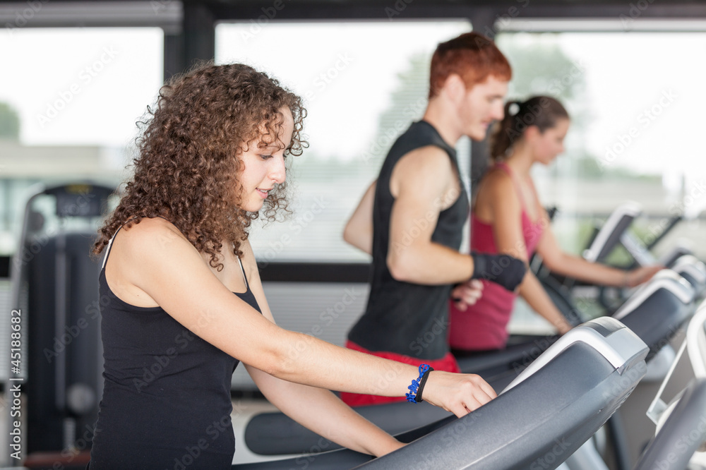 People Running on Treadmill in the Gym