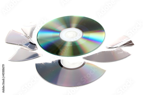 Broken and whole disks with information isolated on white