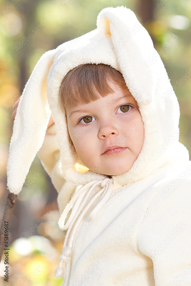 beautiful little girl in costume bunny in the autumn forest beautiful little girl in costume bunny in the autumn forest