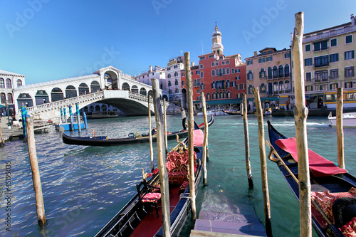 Rialto Bridge with gondolas in Venice, Italy