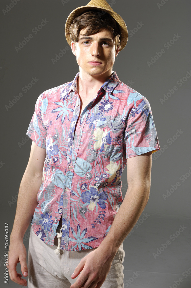 portrait of young happy handsome man wearing a hat portrait of young happy handsome man wearing a hat