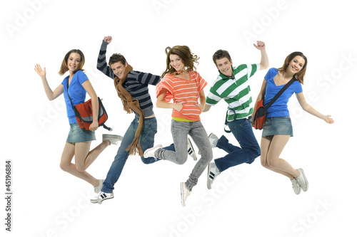 group of young friends jump together with fun
