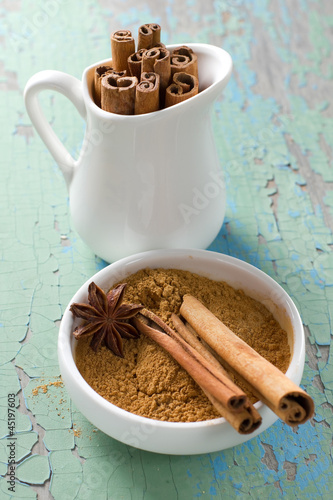 Cinnamon and anise on the vintage wooden surface