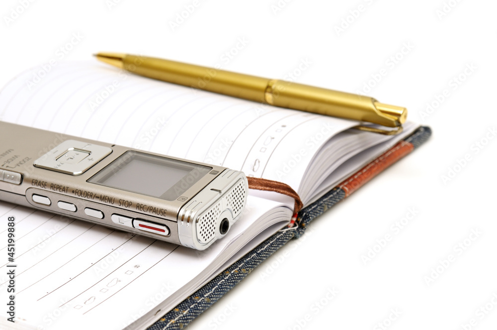 Dictaphone, notepad and ballpen isolated on white background Dictaphone, notepad and ballpen isolated on white background