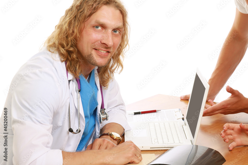 A male doctor at his workplace, isolated on white, side-view A male doctor at his workplace, isolated on white, side-view