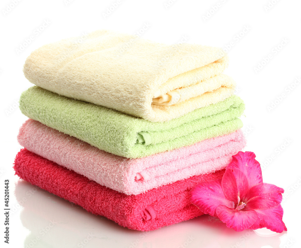 bright towels and flower isolated on white bright towels and flower isolated on white