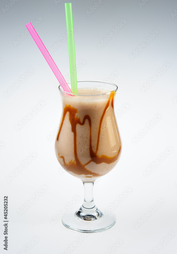 Milkshake with caramel over white background Milkshake with caramel over white background