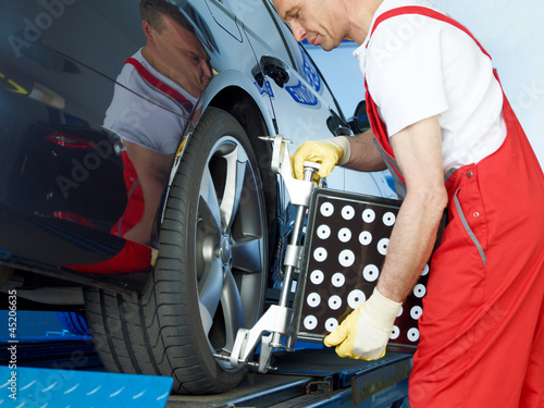 Axle alignment of a car in a garage photo