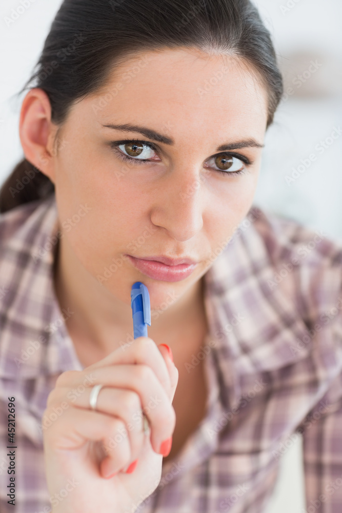 Close up of a woman thinking while looking at camera Close up of a woman thinking while looking at camera