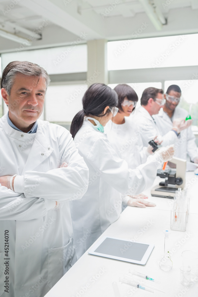 Chemist standing in front of tablet pc Chemist standing in front of tablet pc