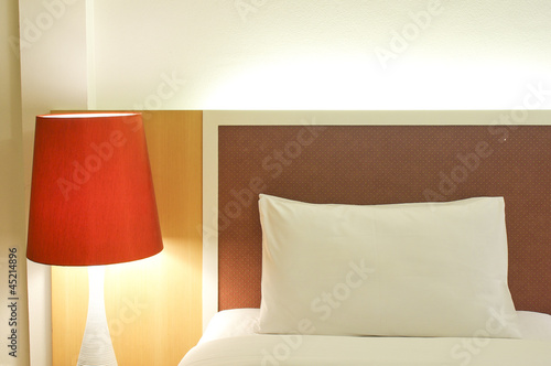 Pillow and Bed in a hotel room at night