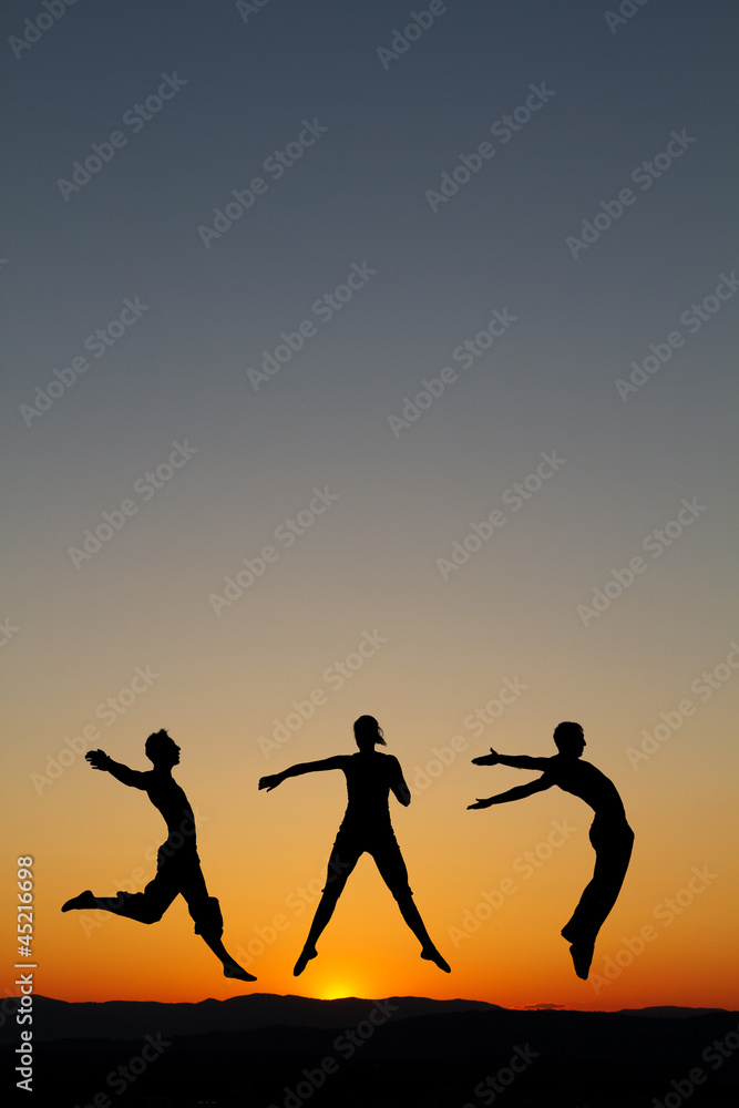 silhouette of dancers in sunset