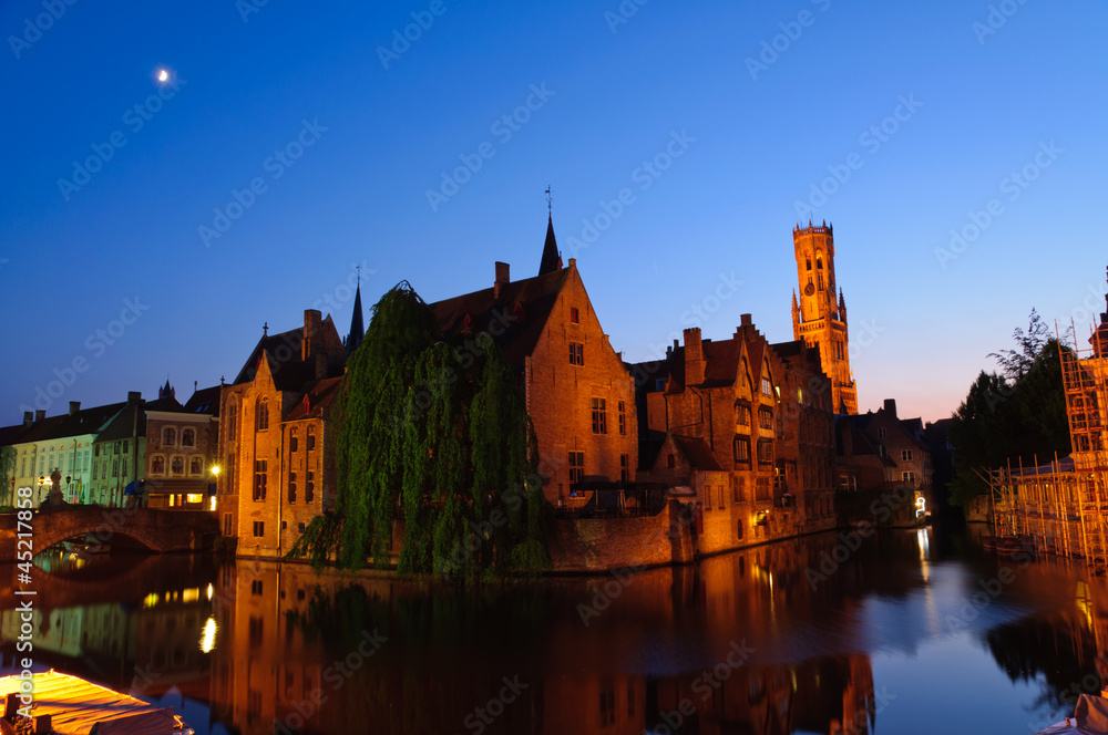 View from the Rozenhoedkaai at the Old Town of Bruges at dusk View from the Rozenhoedkaai at the Old Town of Bruges at dusk