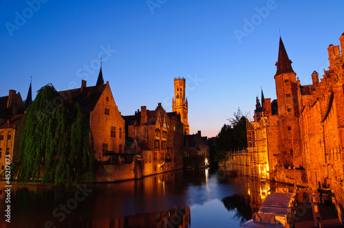 View from the Rozenhoedkaai at the Old Town of Bruges at dusk