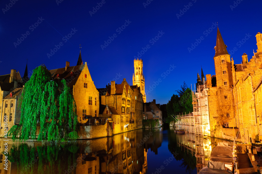 View from the Rozenhoedkaai of the Old Town of Bruges at dusk