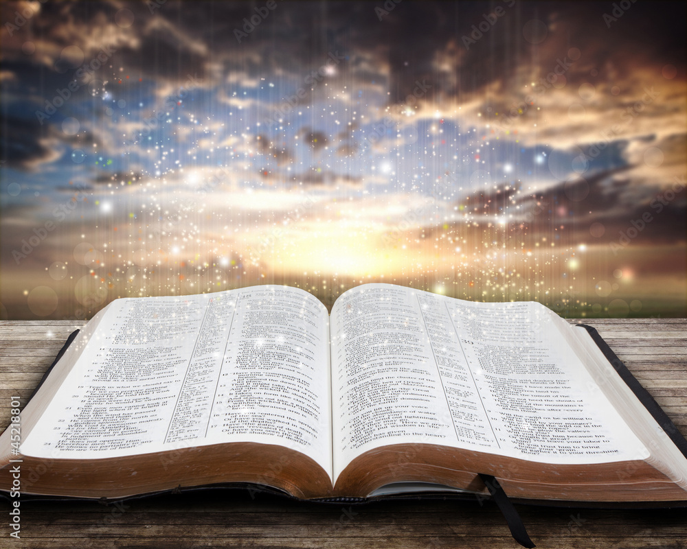 Fototapeta premium Glowing Bible at sunset
