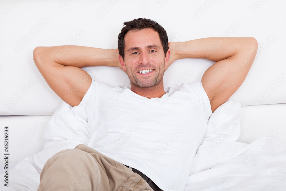 Portrait Of Young Man Relaxing On Bed Portrait Of Young Man Relaxing On Bed