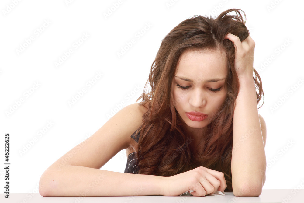 A young tired girl sitting at the desk A young tired girl sitting at the desk