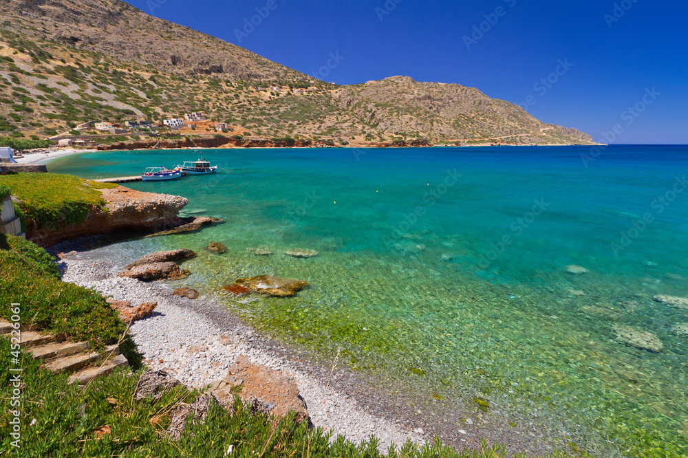 Turquise water of Mirabello bay in Plaka town on Crete, Greece
